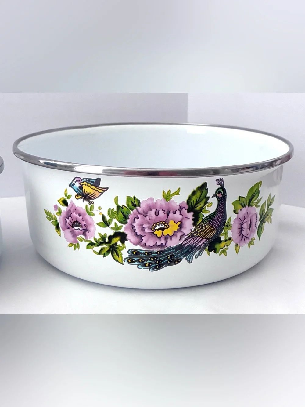 Vintage enamel mixing bowls featuring peacock and floral pattern
